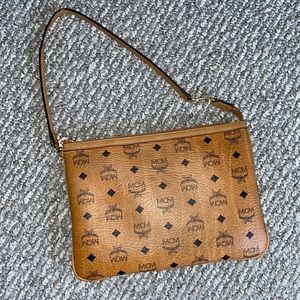 Worn MCM cognac clutch